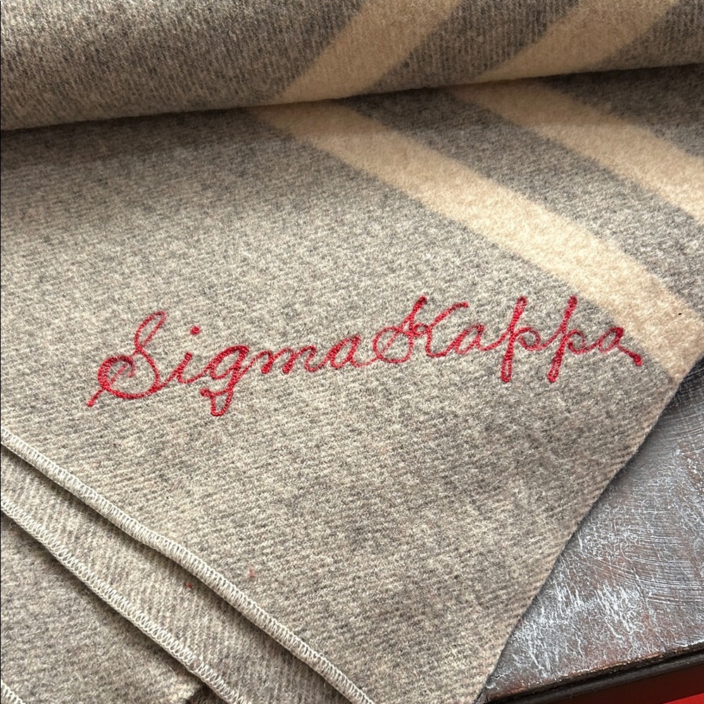 Sigma Kappa wool blanket. 56” x70”. One small tear - see photo. Good weight.